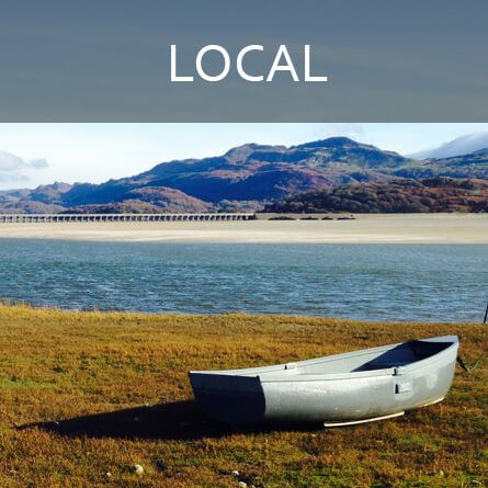 glamping north wales near lake with a boat on shore