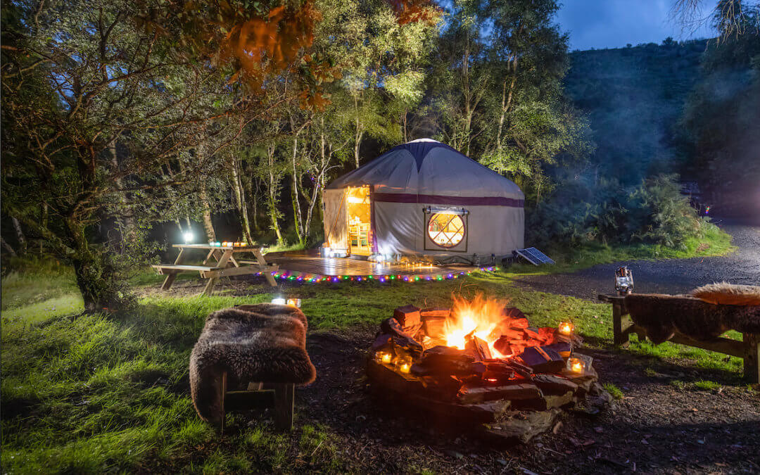Family glamping Wales yurt with firepit lit