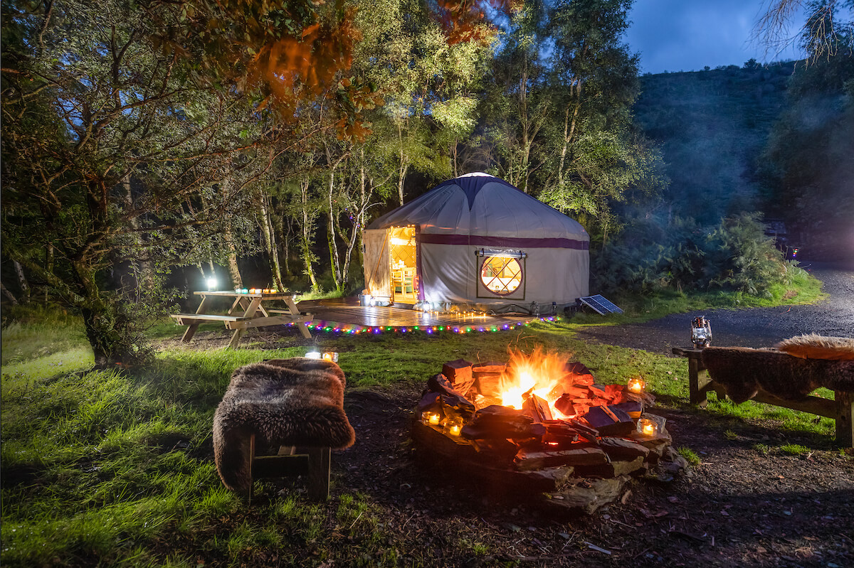 Family glamping Wales yurt with firepit lit