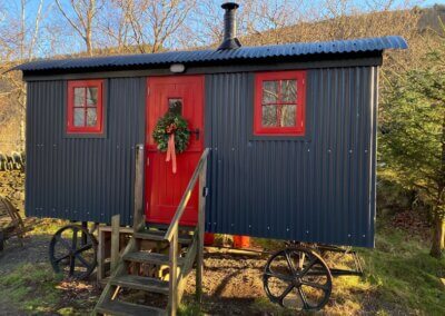 Festive Shpeherd's Hut, Christmas getaways Wales, Snowdonia Christmas glamping