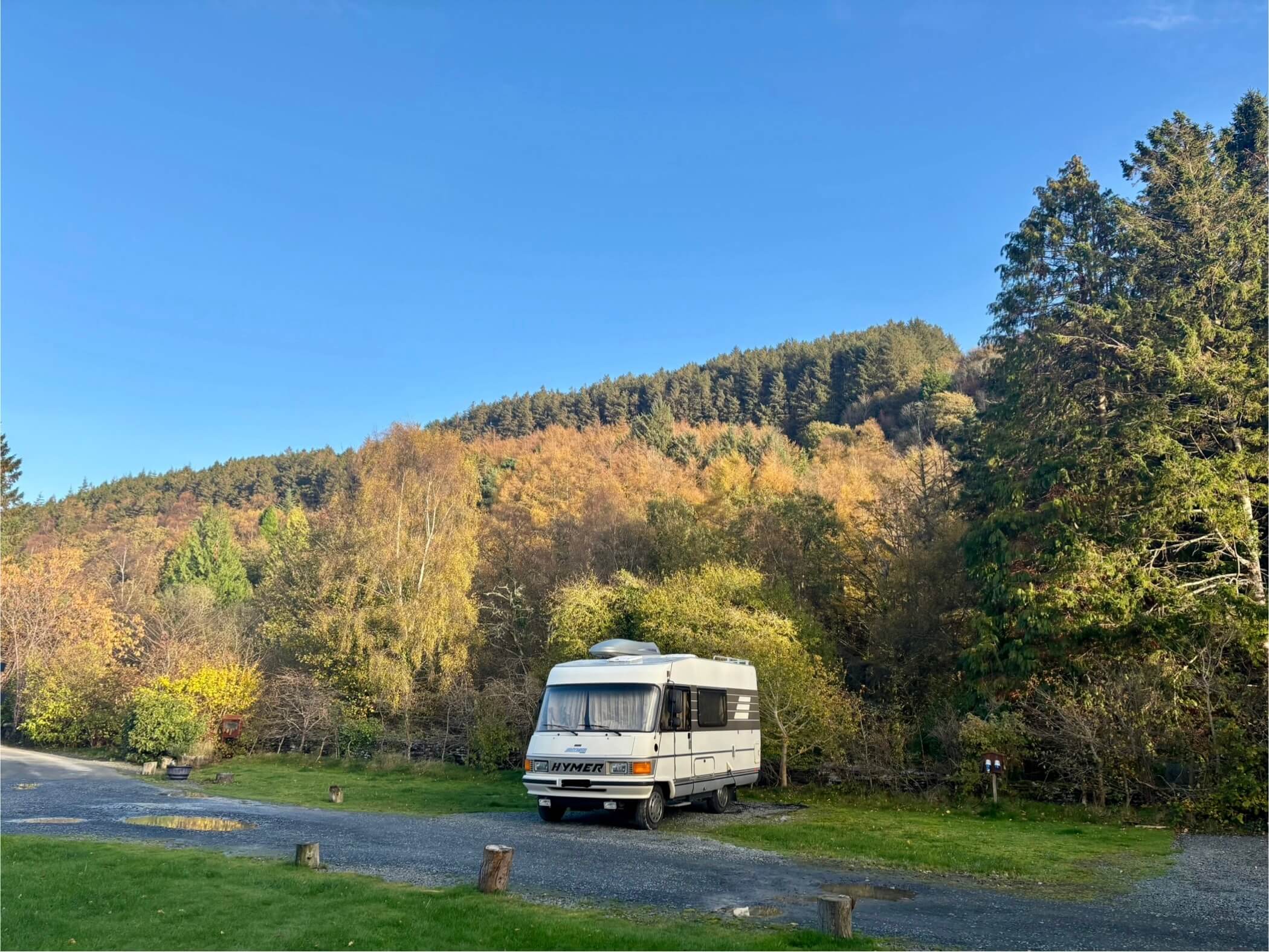 Motorhome with Autumn trees, Wales camping open all year