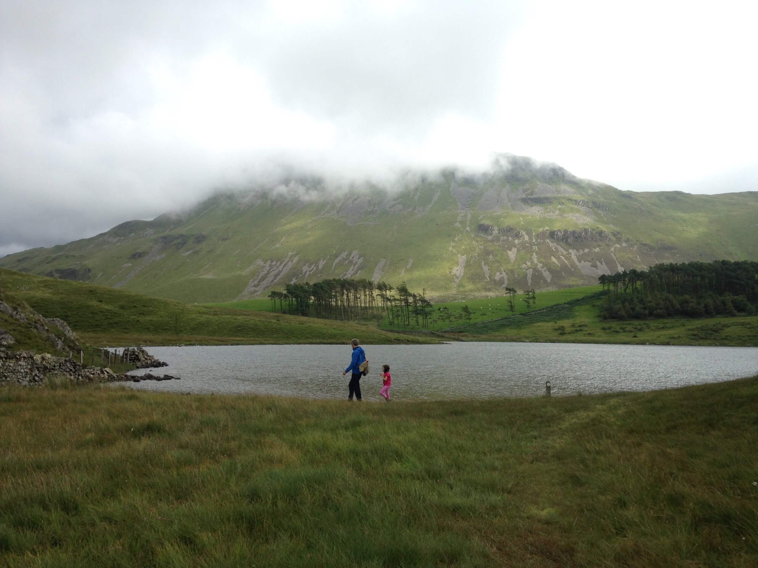 Family by mountain lake, family holidays North Wales