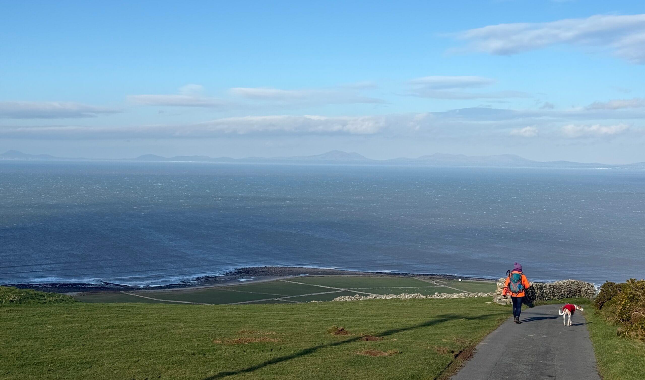 Woman and Dog on Wales Coast Path near Graig Wen